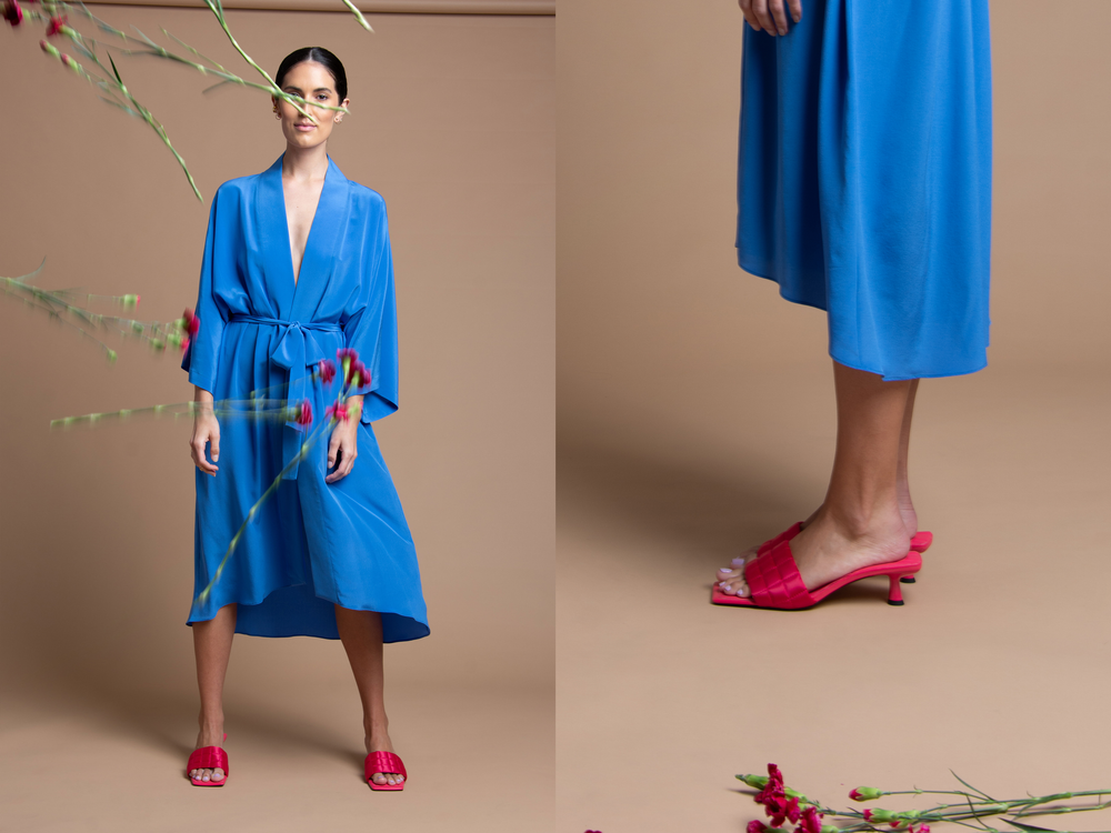 Split images of a model in a blue robe with florals being thrown in the air and florals at her feet.